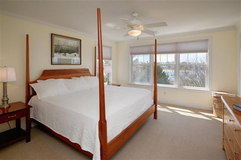 163 Jefferson Road Bourne, MA 02532 - Photo 35 of 35 a bed sitting in a spacious bedroom next to a window