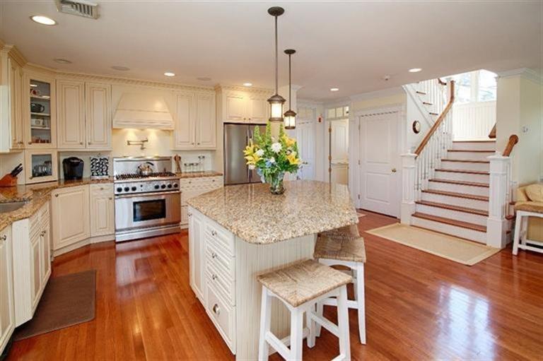 163 Jefferson Road Bourne, MA 02532 - Photo 7 of 35 a kitchen with stove and chairs