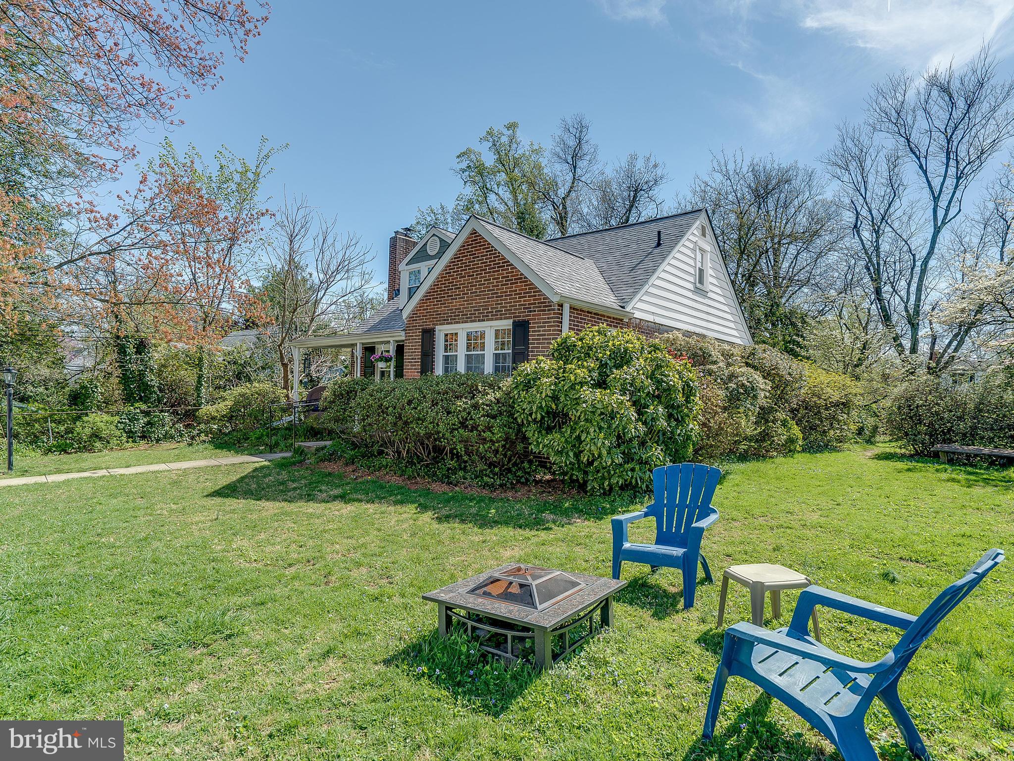 9504 Seminole Street Silver Spring, MD 20901 - Photo 3 of 25 a backyard of a house with table and chairs