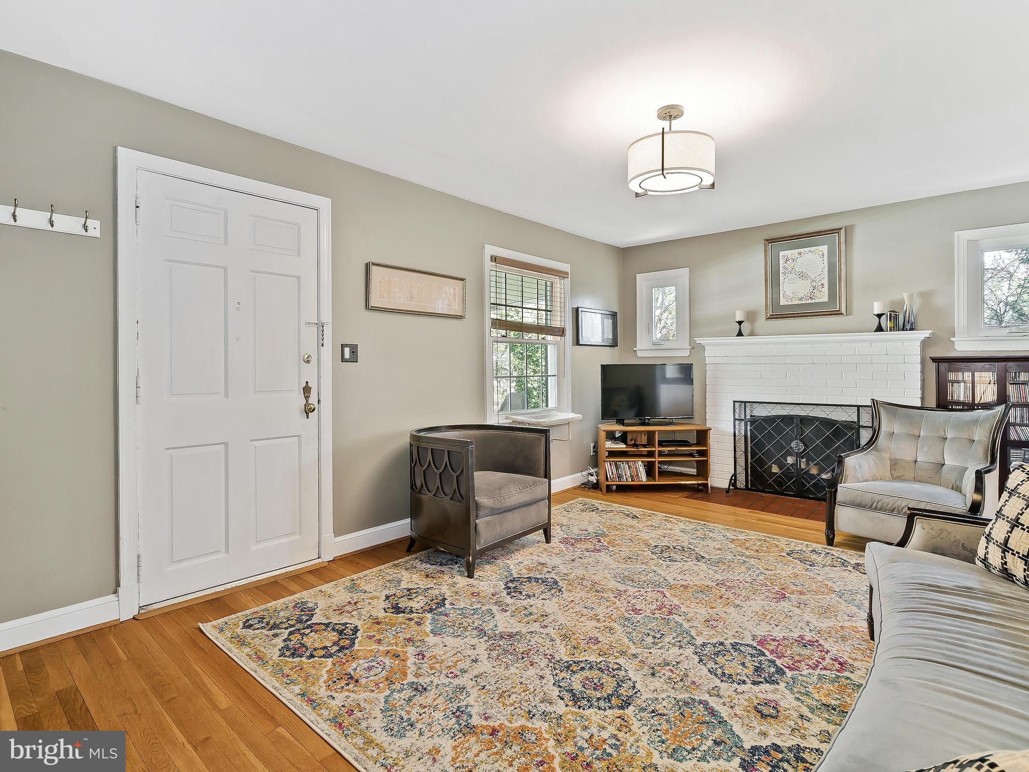 9504 Seminole Street Silver Spring, MD 20901 - Photo 4 of 25 a living room with furniture and a fireplace