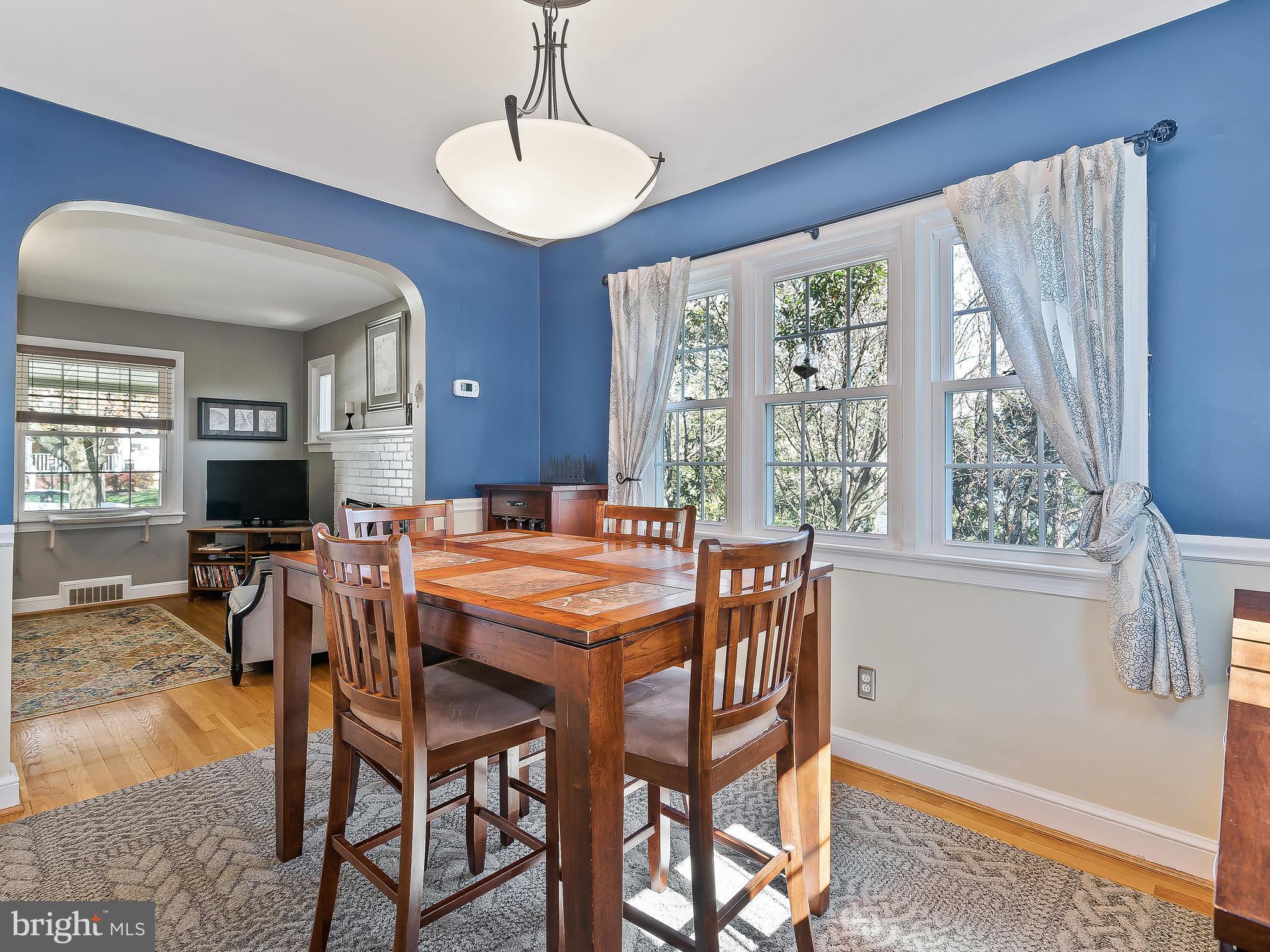 9504 Seminole Street Silver Spring, MD 20901 - Photo 7 of 25 a view of a dining room with furniture window and wooden floor