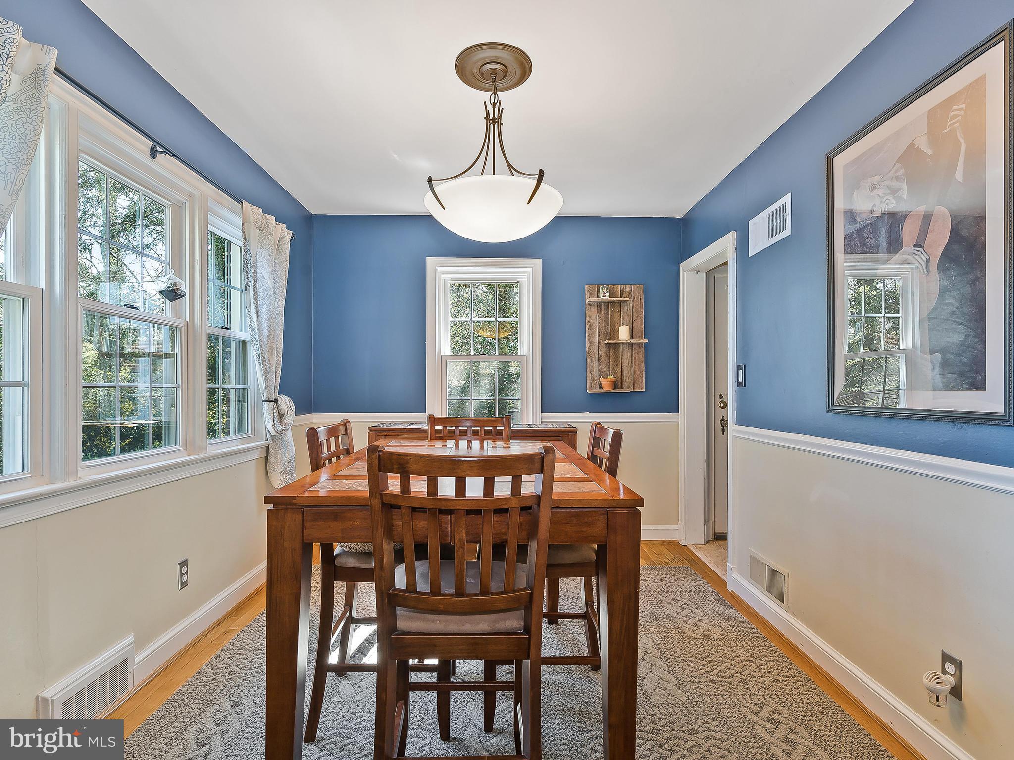9504 Seminole Street Silver Spring, MD 20901 - Photo 8 of 25 a view of a dining room with furniture window and wooden floor