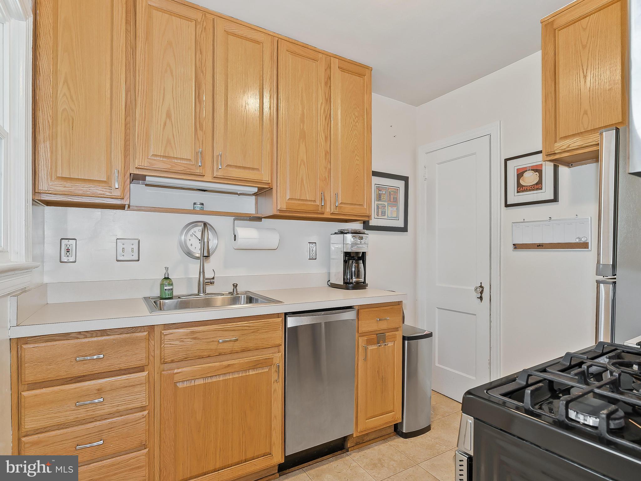 9504 Seminole Street Silver Spring, MD 20901 - Photo 10 of 25 a kitchen with stainless steel appliances granite countertop a sink stove and cabinets