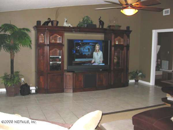 3050 Magnolia Road Orange Park, FL 32065 - Photo 5 of 15 a living room with furniture and a fireplace
