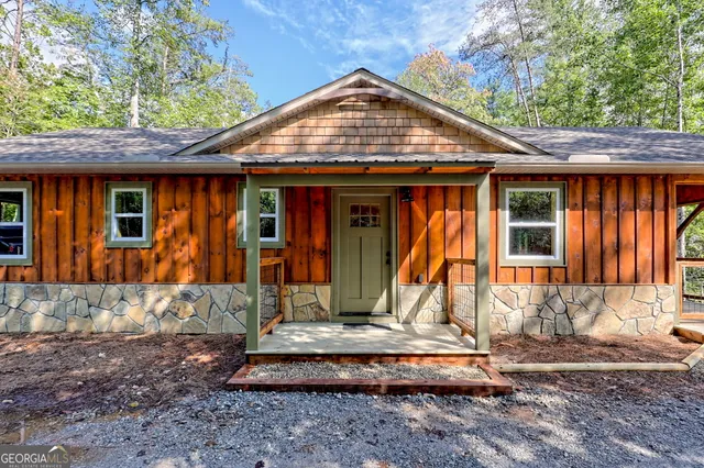 a view of a street with potted plants