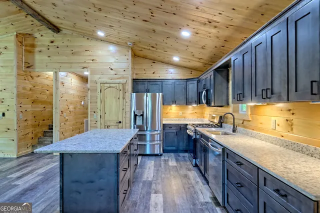 a view of a street with potted plants