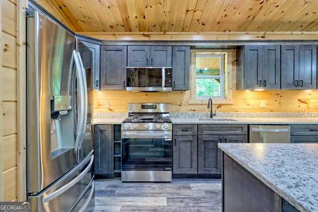 a view of hallway with wooden floor