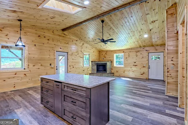 a bathroom with a sink a mirror and shower