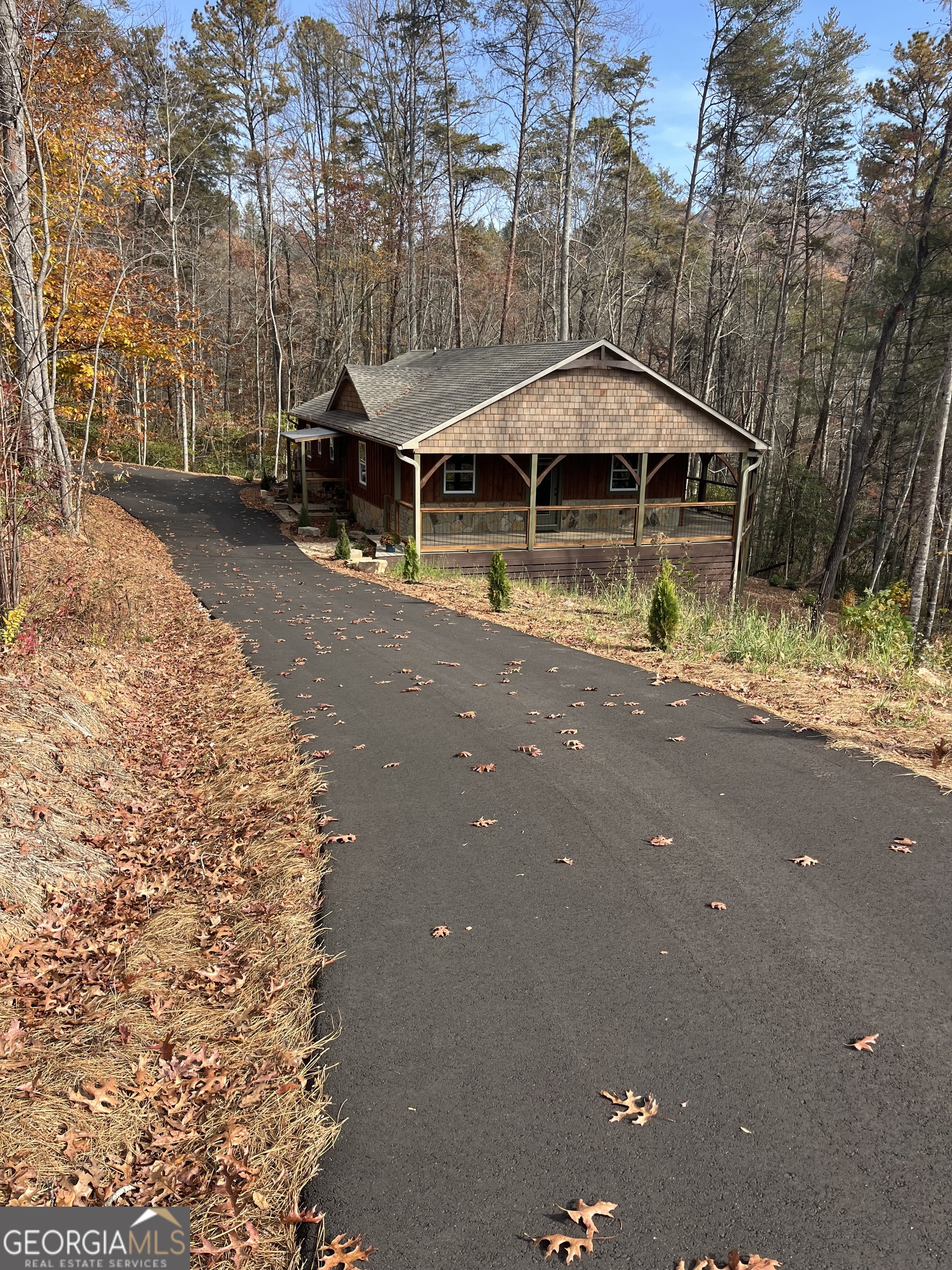108 Olds Mountain Rabun Gap, GA 30568 - Photo 2 of 73 a front view of a house with a yard