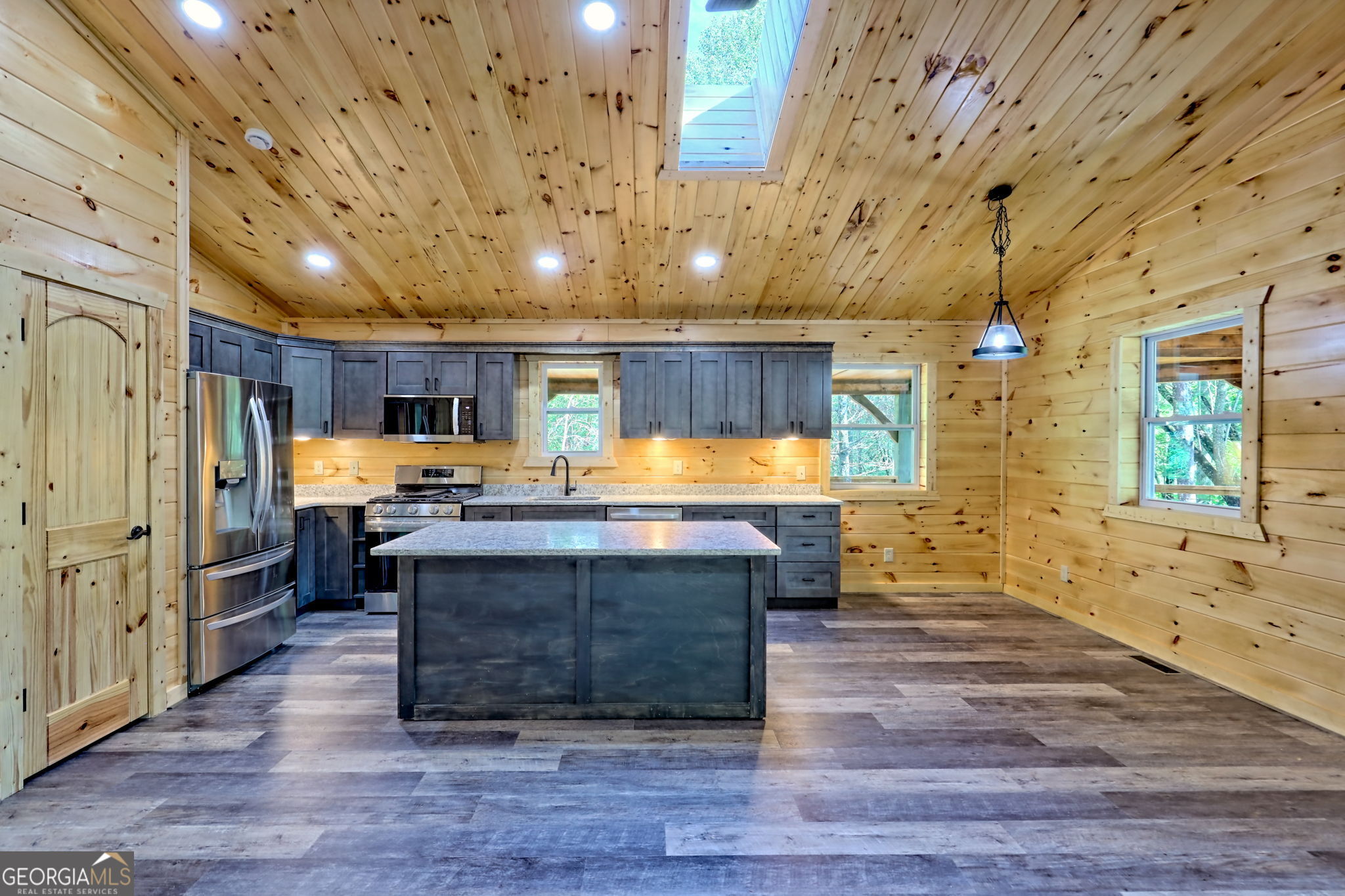 108 Olds Mountain Rabun Gap, GA 30568 - Photo 24 of 73 a kitchen with stainless steel appliances granite countertop a stove and a refrigerator
