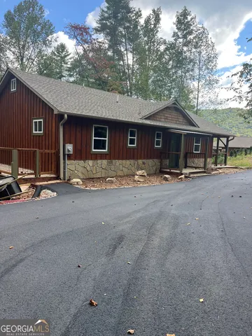 a view of a bathroom with wooden door