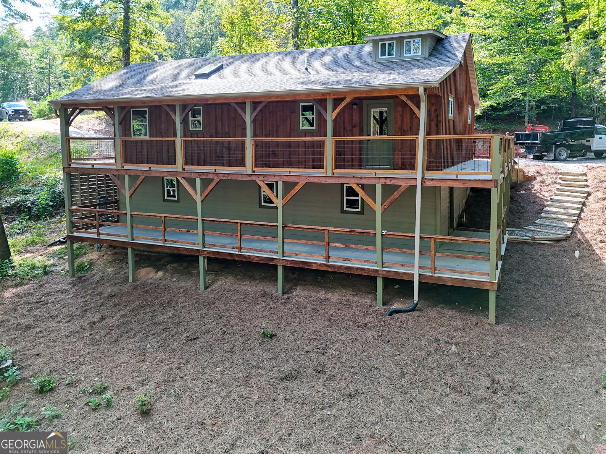 108 Olds Mountain Rabun Gap, GA 30568 - Photo 3 of 73 a front view of a house with a yard