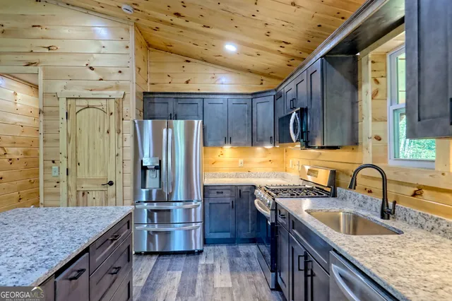 a bathroom with a sink a mirror and shower