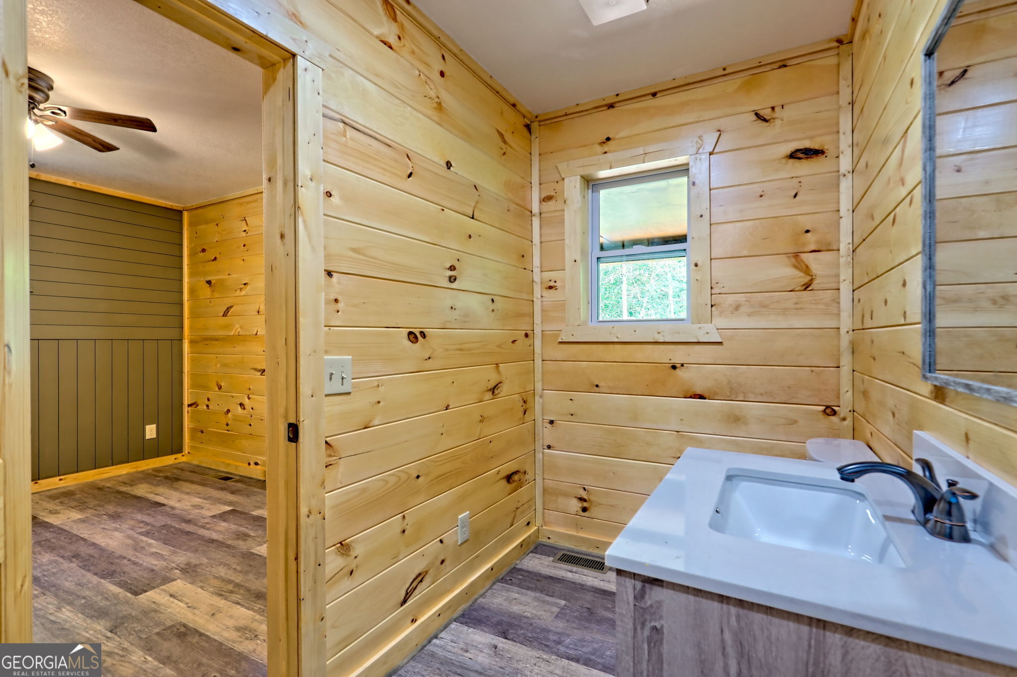 108 Olds Mountain Rabun Gap, GA 30568 - Photo 54 of 73 a bathroom with a sink a mirror and shower