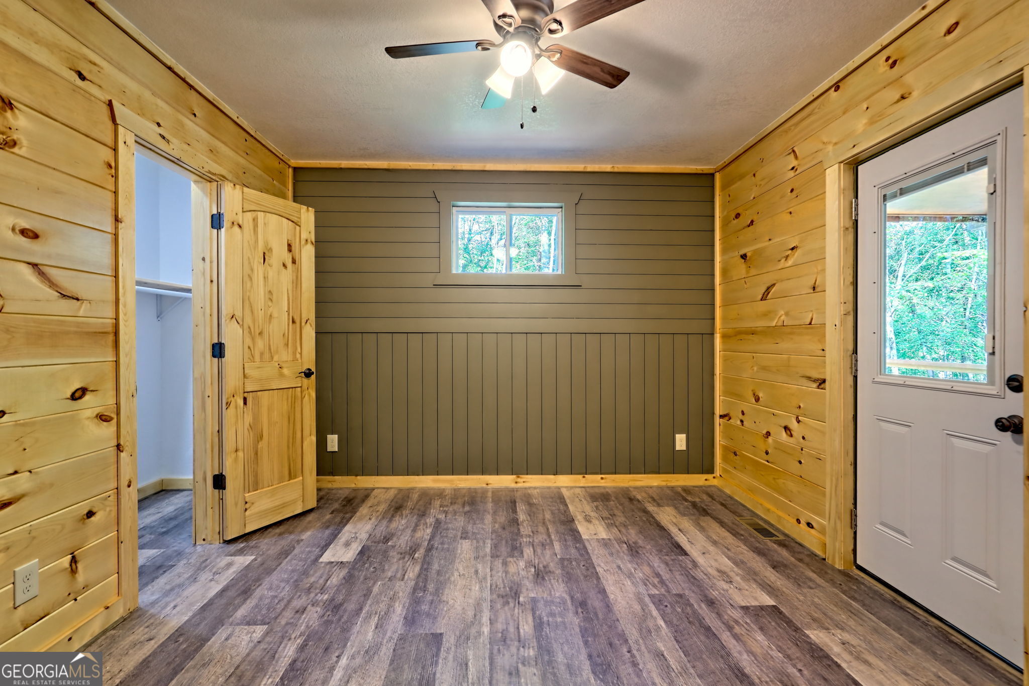 108 Olds Mountain Rabun Gap, GA 30568 - Photo 55 of 73 a view of a hallway with wooden floor and a bathroom