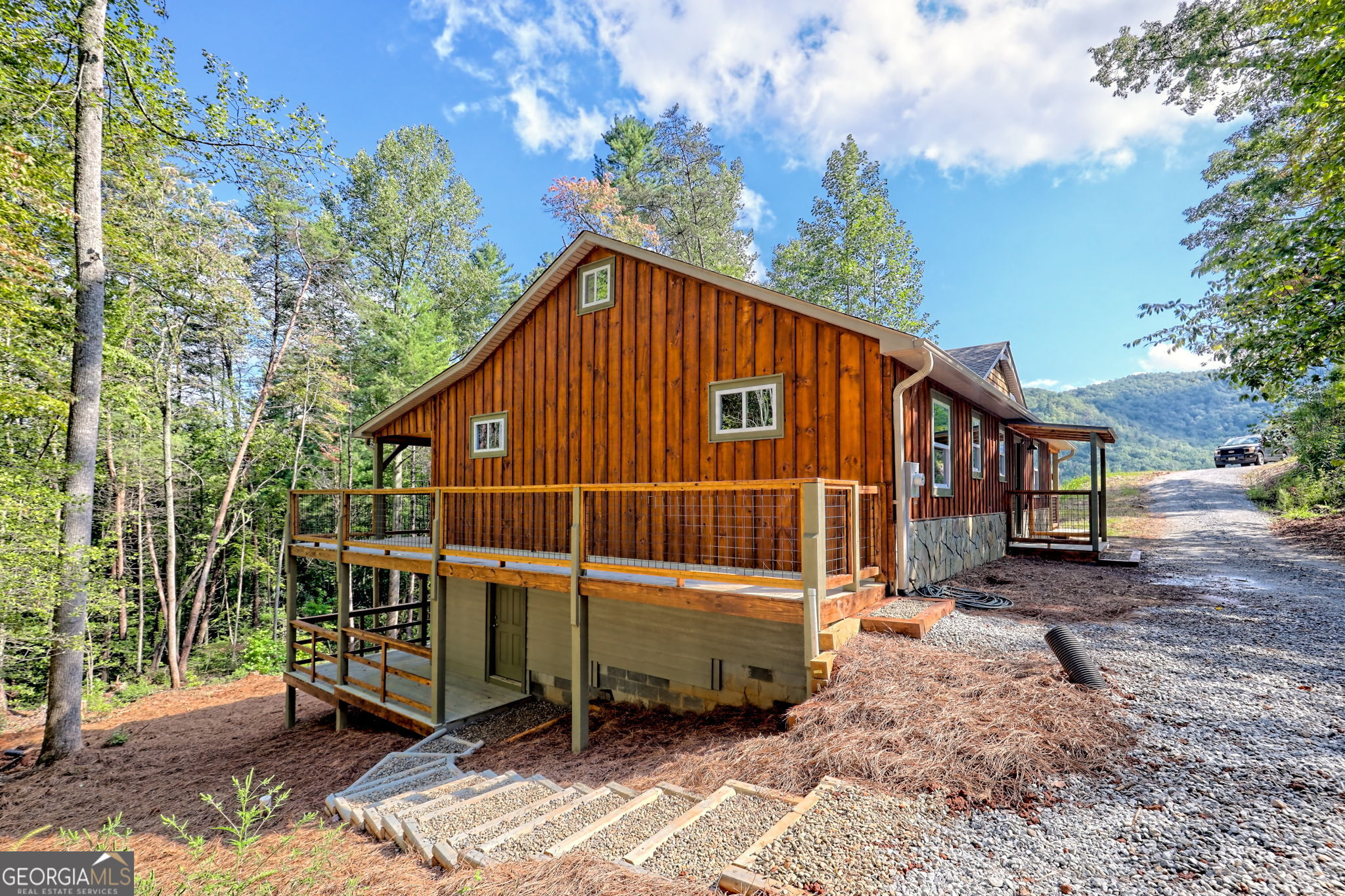 108 Olds Mountain Rabun Gap, GA 30568 - Photo 72 of 73 a view of a house with a yard siting area and garden
