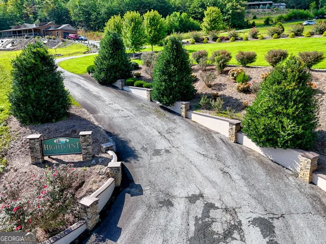 a kitchen with stainless steel appliances granite countertop a stove refrigerator and microwave