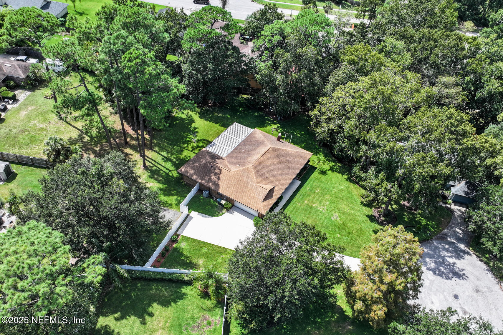 12876 Squirrel Tree Court Jacksonville, FL 32246 - Photo 11 of 33 an aerial view of a house with a yard and trees