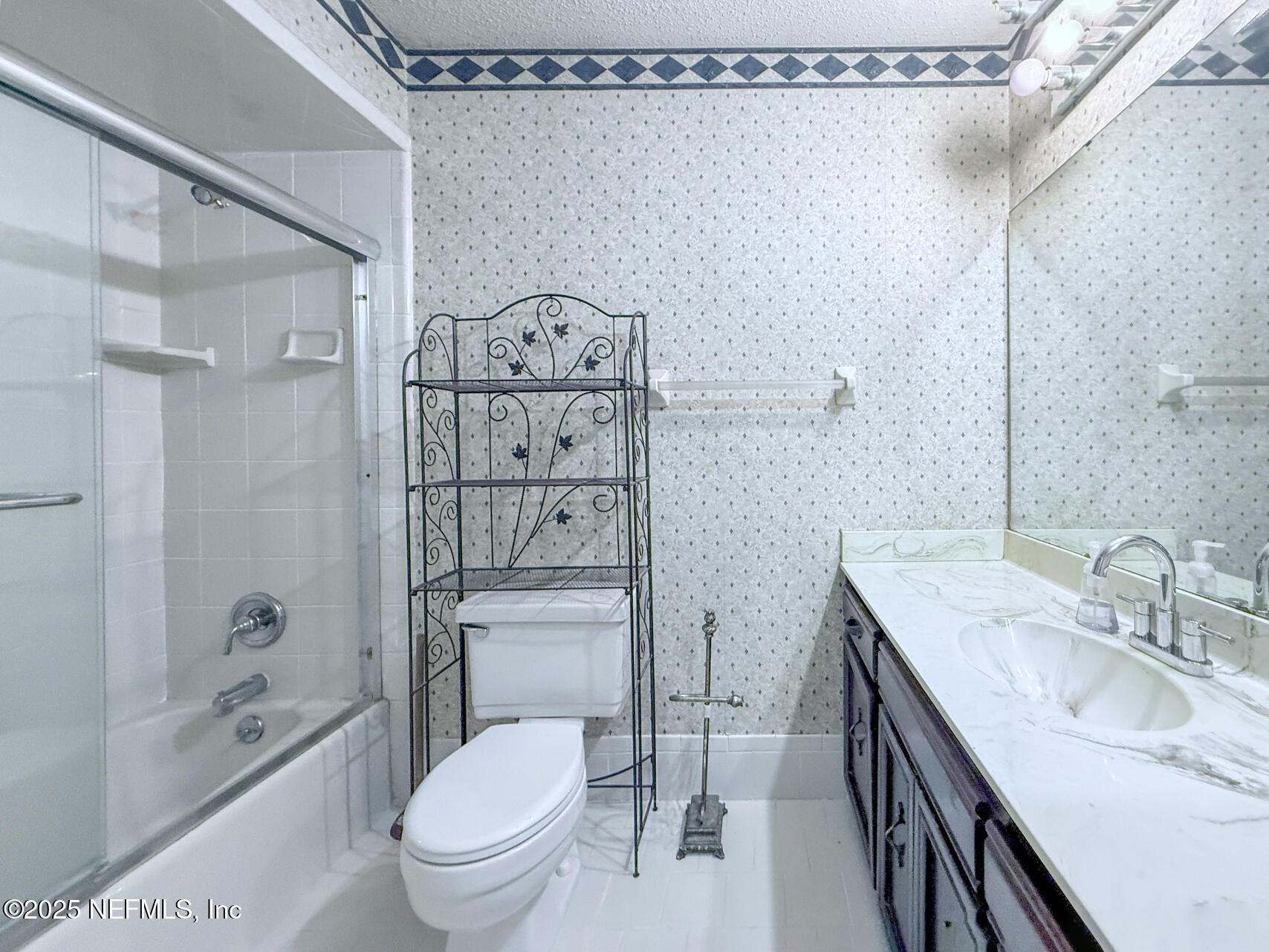 12876 Squirrel Tree Court Jacksonville, FL 32246 - Photo 16 of 33 a bathroom with a sink a toilet and shower