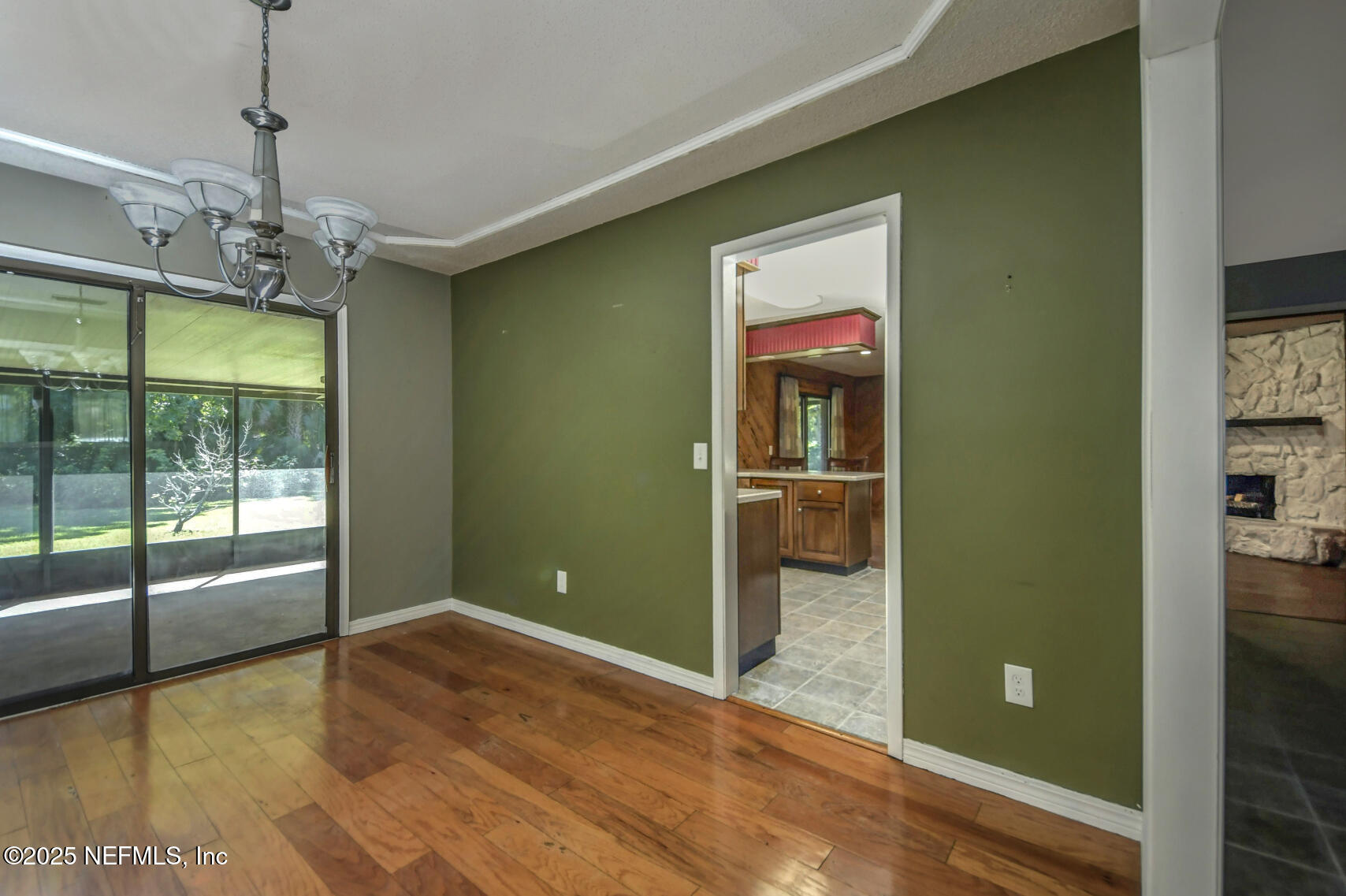 12876 Squirrel Tree Court Jacksonville, FL 32246 - Photo 21 of 33 a view of a livingroom with a chandelier