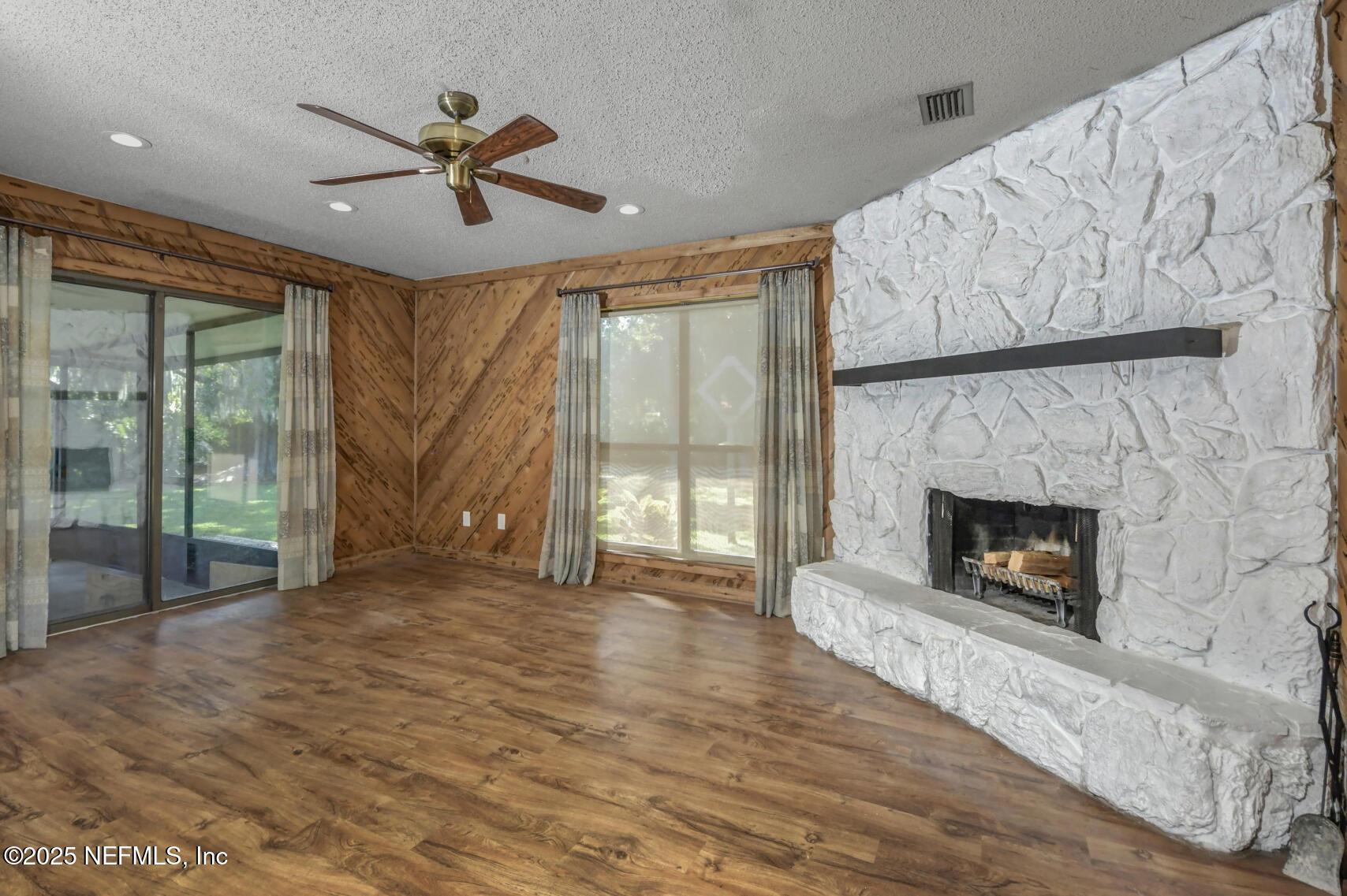 12876 Squirrel Tree Court Jacksonville, FL 32246 - Photo 22 of 33 a view of a livingroom with a fireplace and window