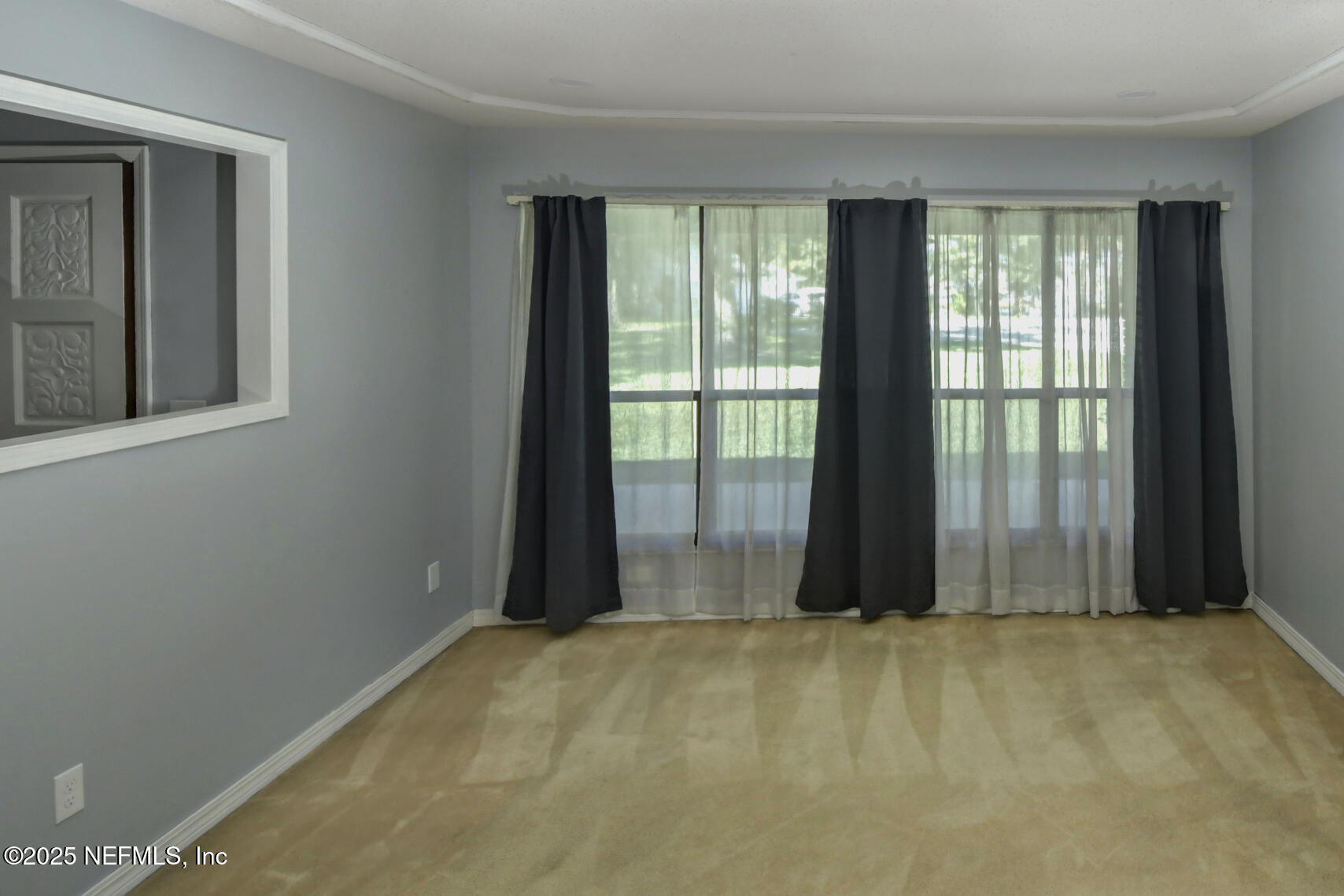 12876 Squirrel Tree Court Jacksonville, FL 32246 - Photo 27 of 33 a view of an empty room with a window