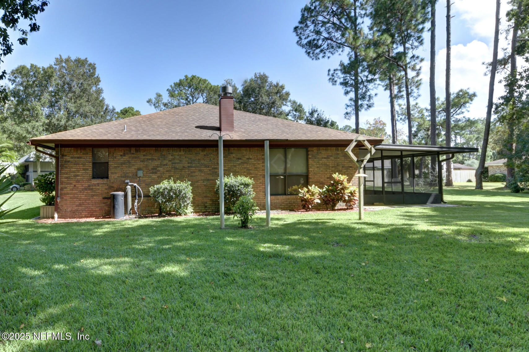 12876 Squirrel Tree Court Jacksonville, FL 32246 - Photo 5 of 33 a front view of a house with a garden