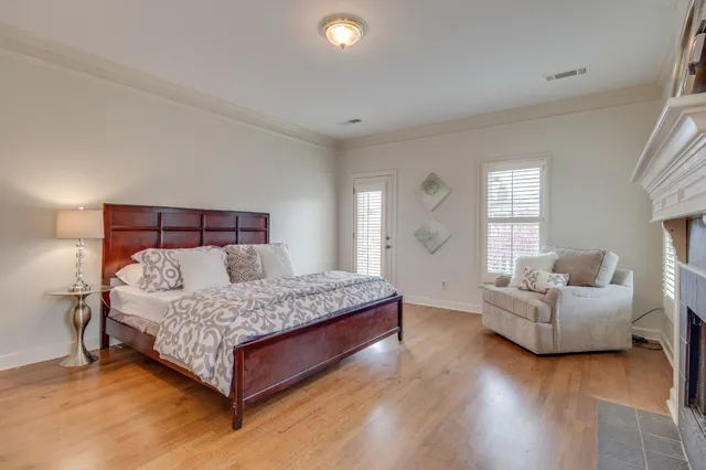 a bedroom with a bed and a couch