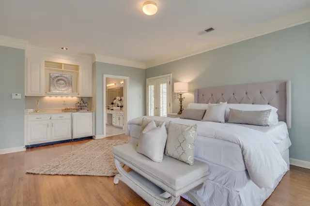 a bedroom with a bed and a fireplace