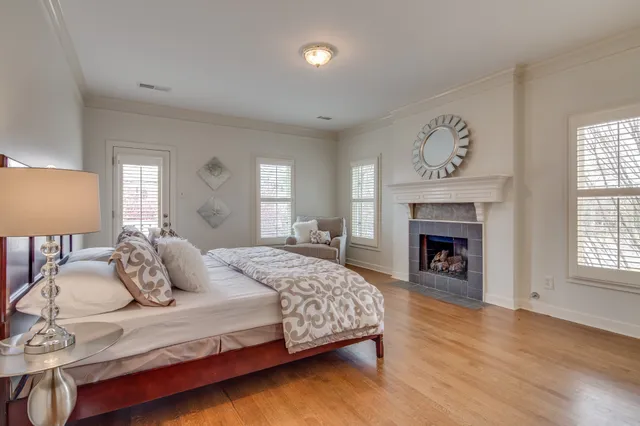 a bedroom with a bed and a fireplace