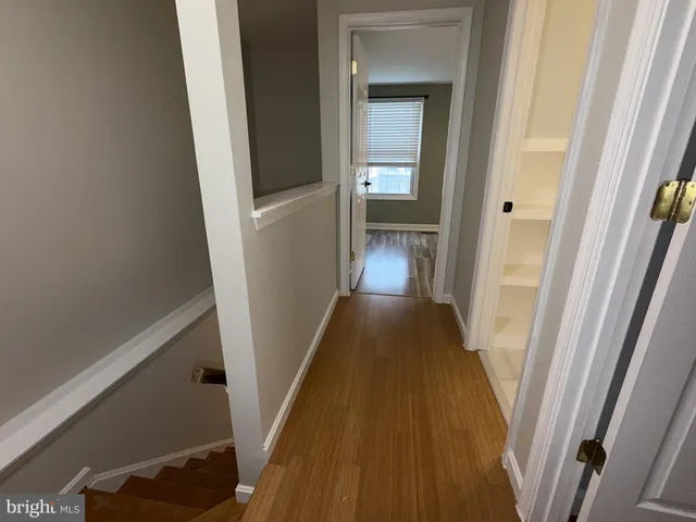 a bathroom with double vanity sink a toilet and shower