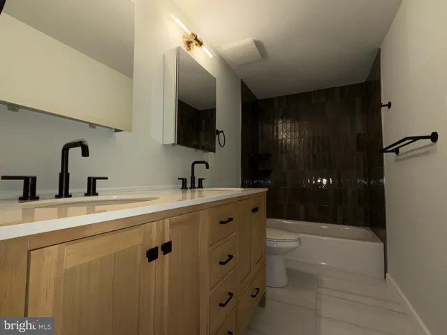 a bathroom with a shower and a bath tub