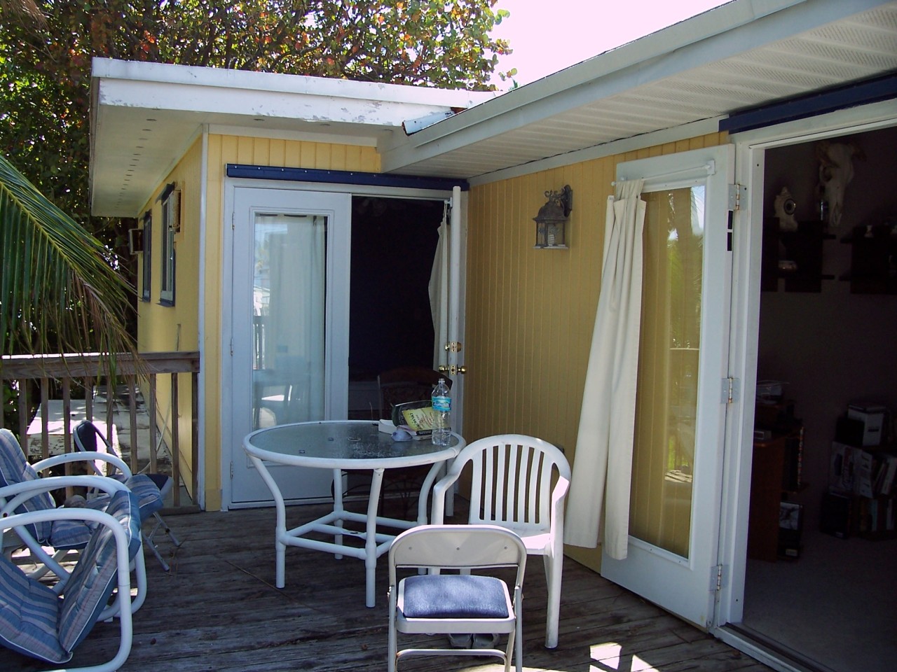 82 North Conch Avenue Marathon, FL 33050 - Photo 11 of 22 a view of a dining room with furniture and wooden floor