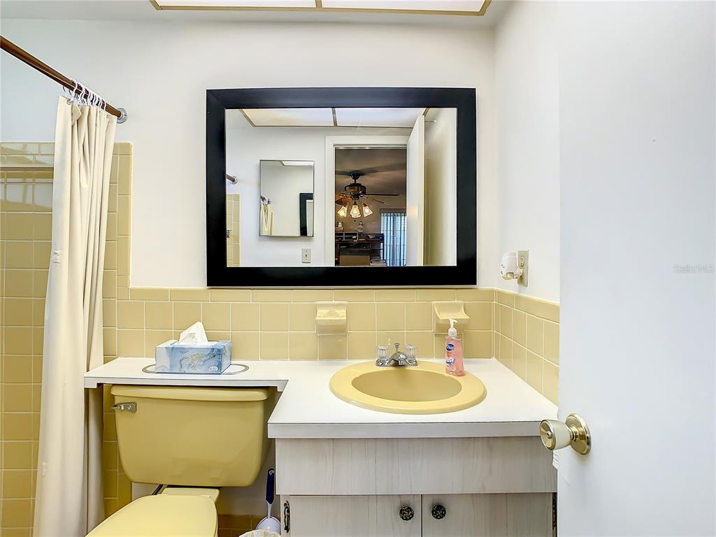 4230 Redcliff Place, Unit 4230 New Port Richey, FL 34652 - Photo 18 of 42 a bathroom with a toilet sink and mirror