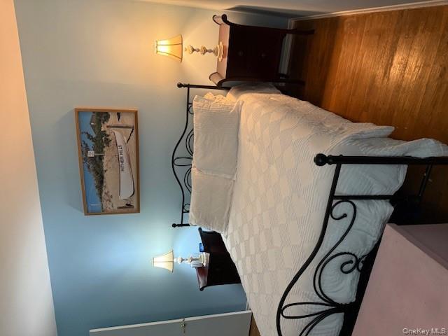 433 Browns Road Nesconset, NY 11767 - Photo 13 of 47 a bed sitting in a bedroom next to a lamp