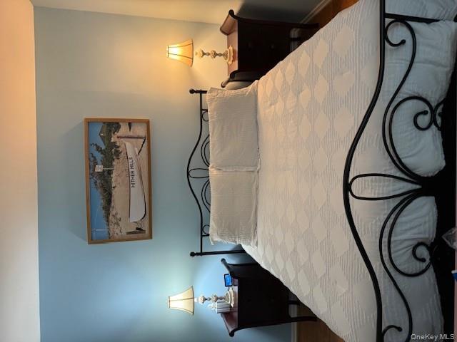 433 Browns Road Nesconset, NY 11767 - Photo 14 of 47 a bedroom with a bed and dresser