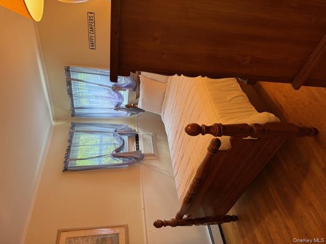 433 Browns Road Nesconset, NY 11767 - Photo 21 of 47 a bed sitting in a spacious bedroom next to a window