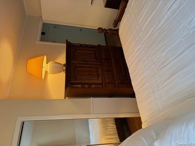 433 Browns Road Nesconset, NY 11767 - Photo 22 of 47 a bedroom with a bed and wooden floor