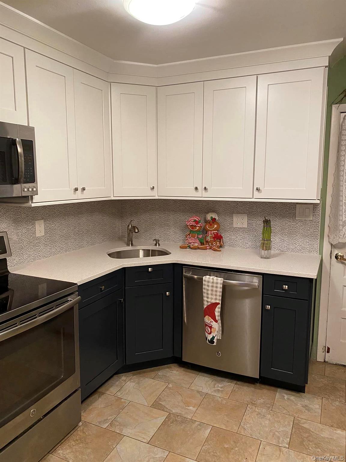 433 Browns Road Nesconset, NY 11767 - Photo 27 of 47 a kitchen with stainless steel appliances granite countertop a sink and cabinets