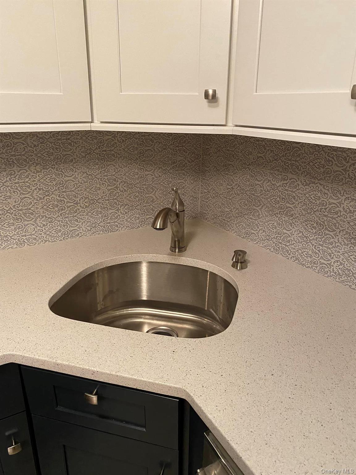 433 Browns Road Nesconset, NY 11767 - Photo 28 of 47 a close view of sink a faucet and cabinets