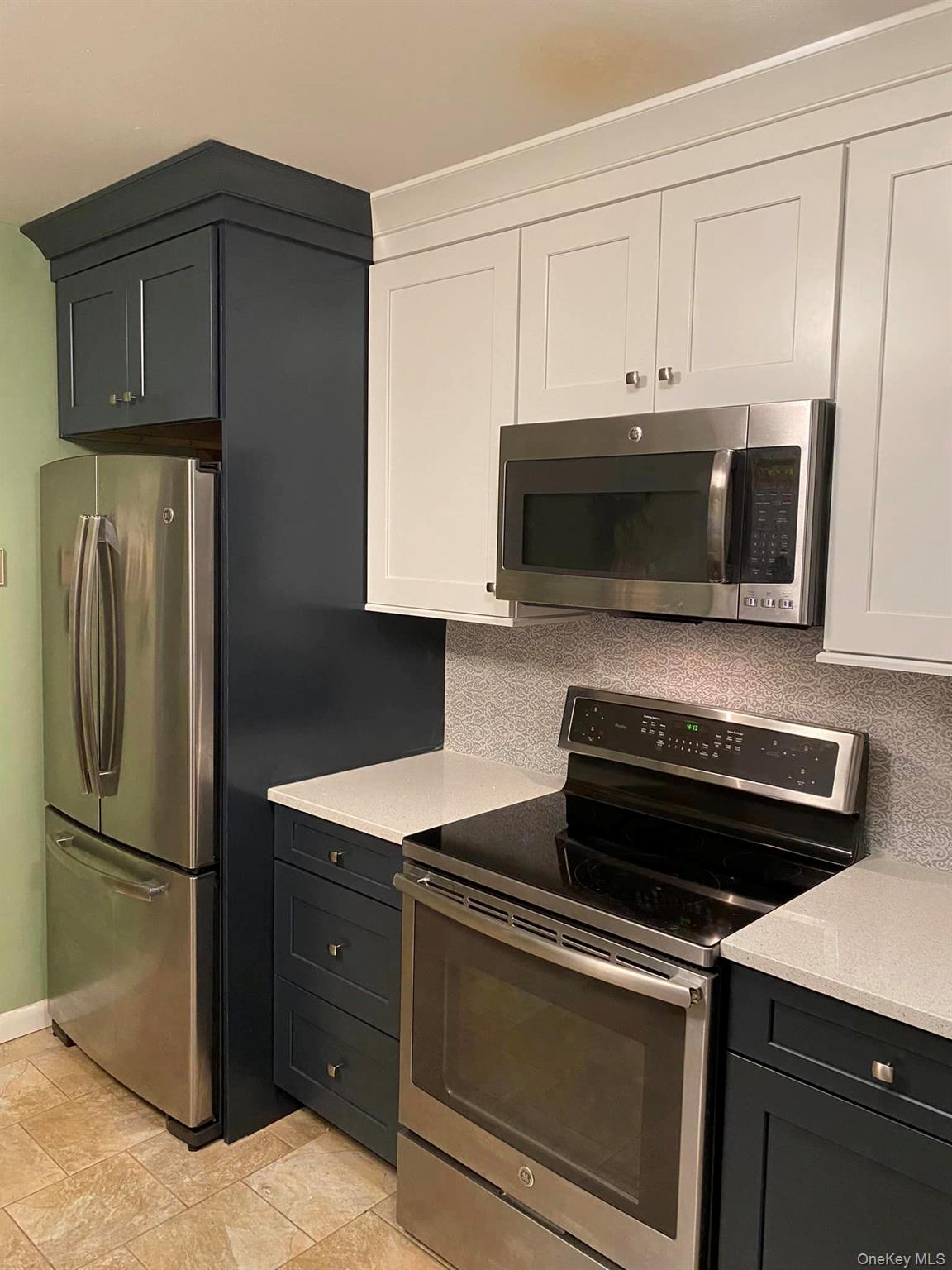 433 Browns Road Nesconset, NY 11767 - Photo 29 of 47 a kitchen with cabinets and steel stainless steel appliances