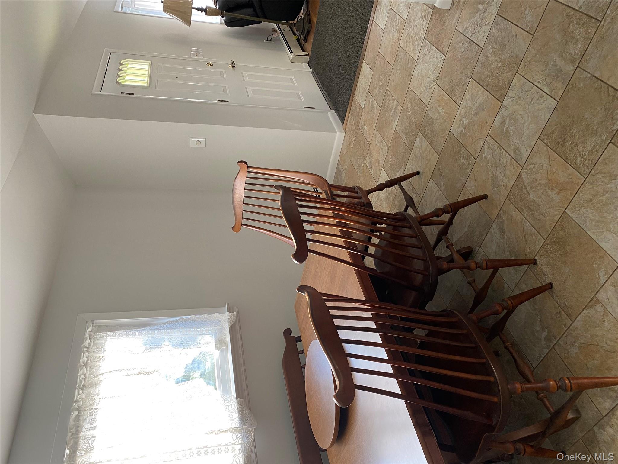 433 Browns Road Nesconset, NY 11767 - Photo 31 of 47 a view of a dining room with furniture and a window