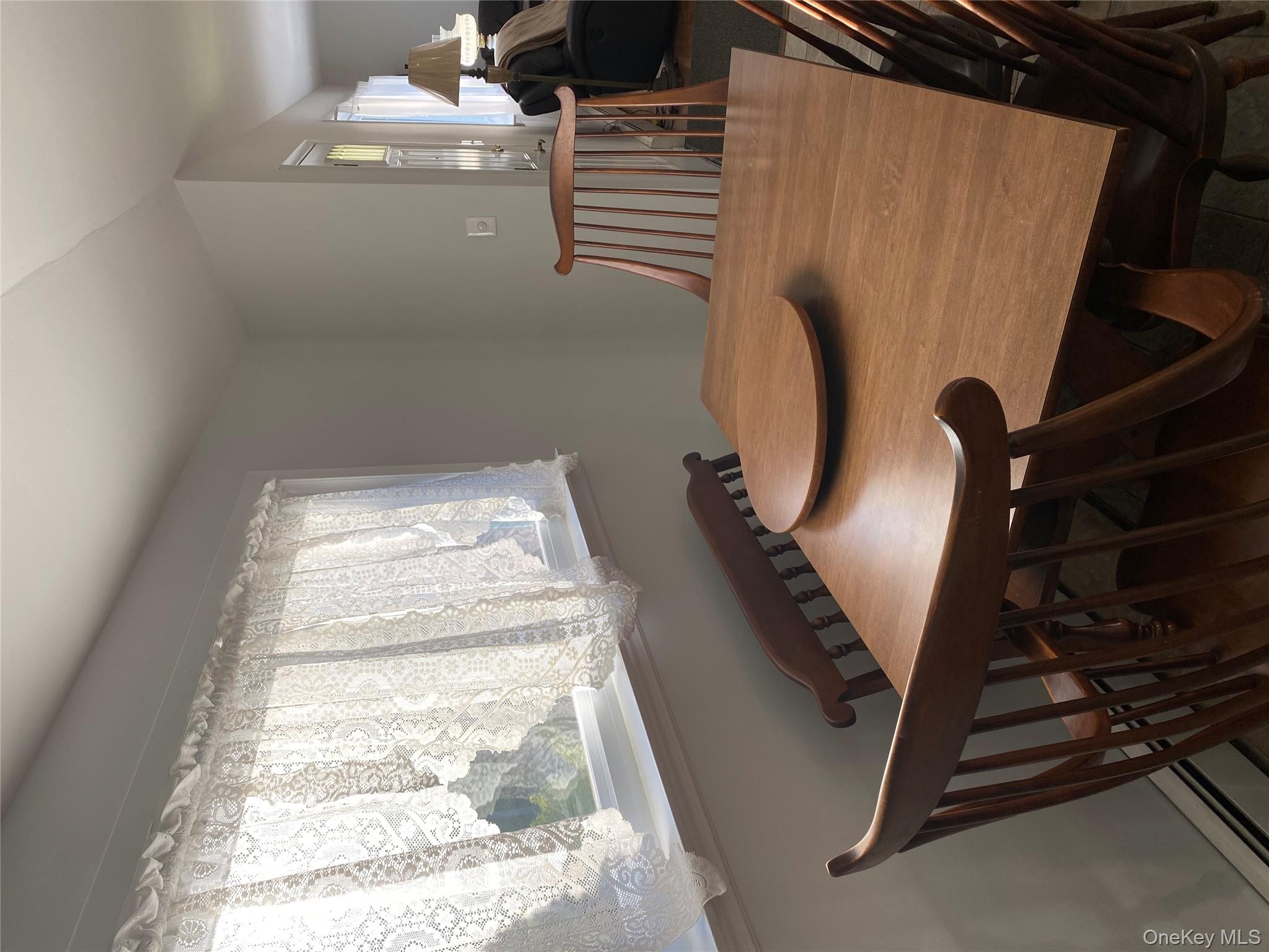 433 Browns Road Nesconset, NY 11767 - Photo 33 of 47 a view of a dining room with furniture and window