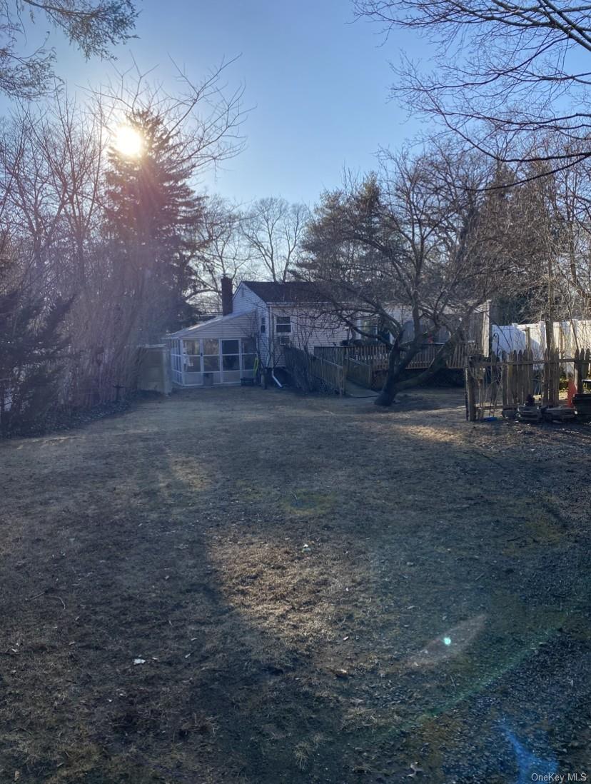 433 Browns Road Nesconset, NY 11767 - Photo 45 of 47 a view of a yard with a tree