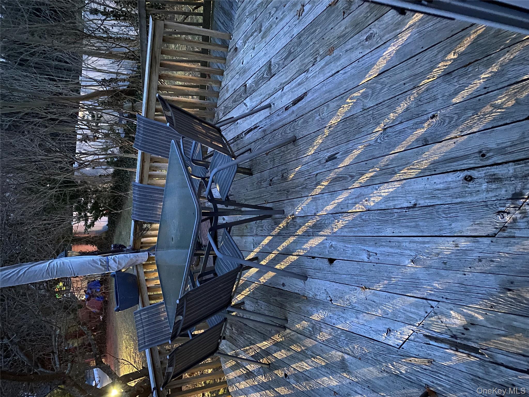 433 Browns Road Nesconset, NY 11767 - Photo 46 of 47 a view of balcony with wooden floor and outdoor seating