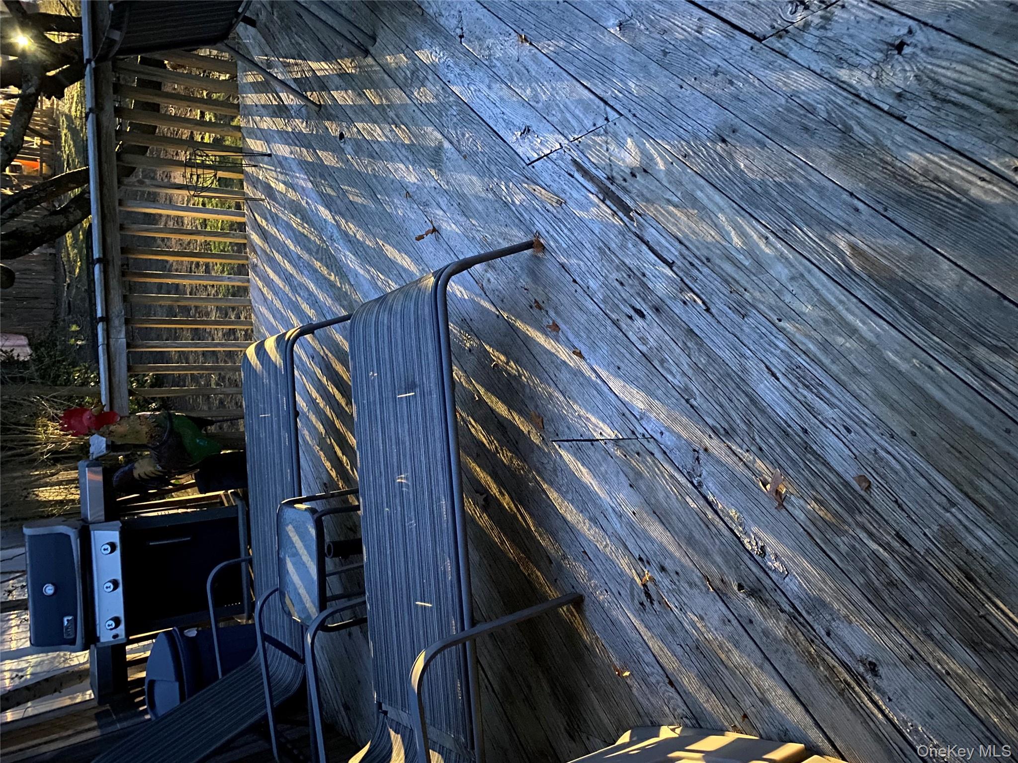 433 Browns Road Nesconset, NY 11767 - Photo 47 of 47 a view of a wooden deck with a patio