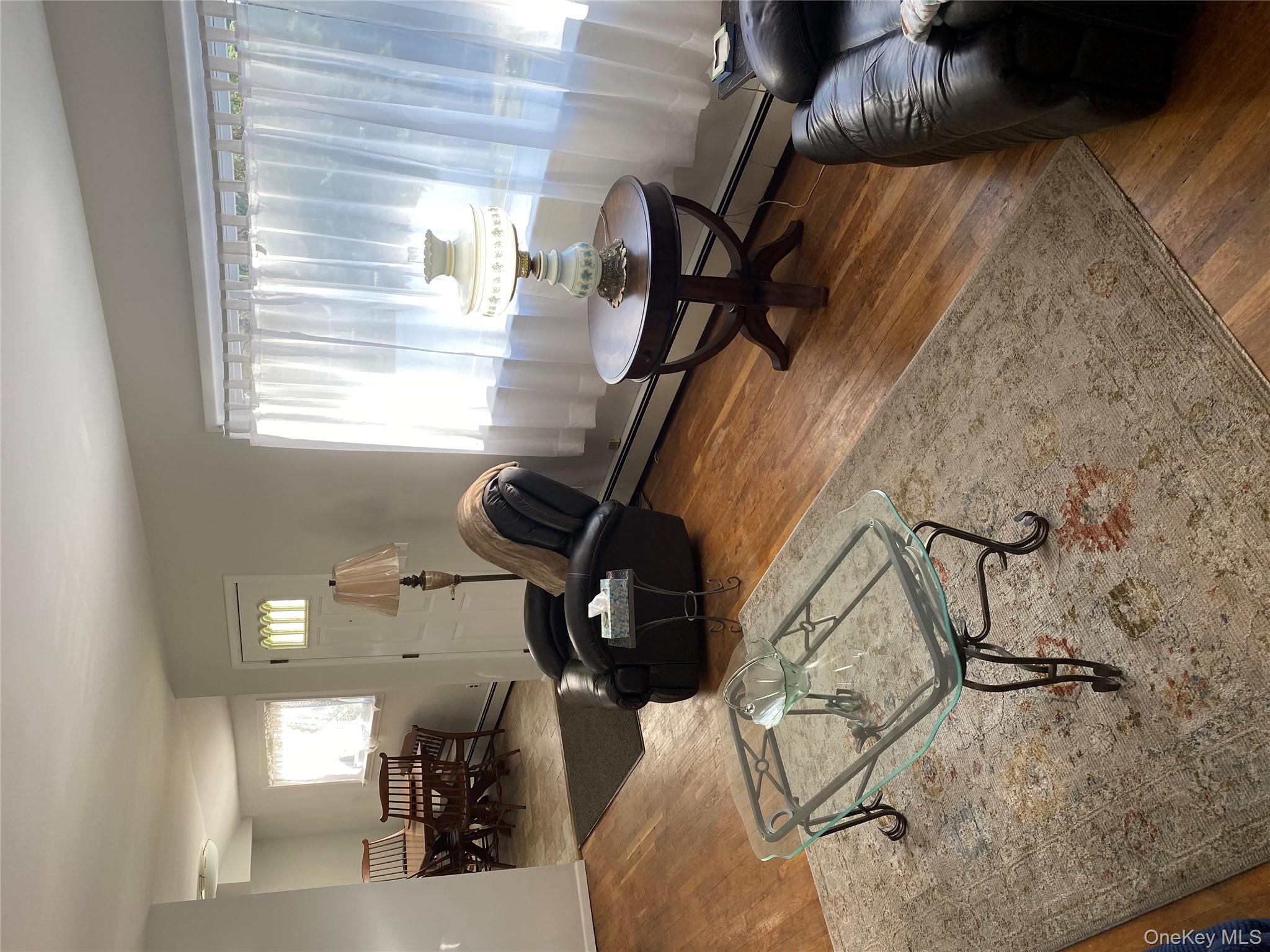 433 Browns Road Nesconset, NY 11767 - Photo 10 of 47 a living room with furniture and a table