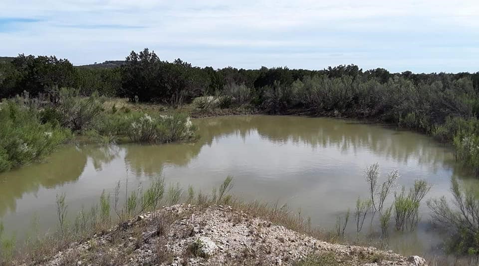 932 High Country Road Blanco, TX 78606 - Photo 7 of 23 a view of a lake with a mountain in the background