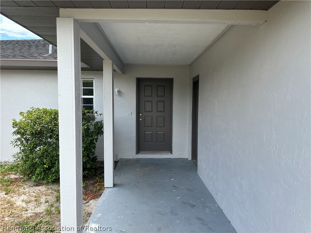 237 Rhapsody Avenue Lake Placid, FL 33852 - Photo 2 of 18 a view of a house with a outdoor space