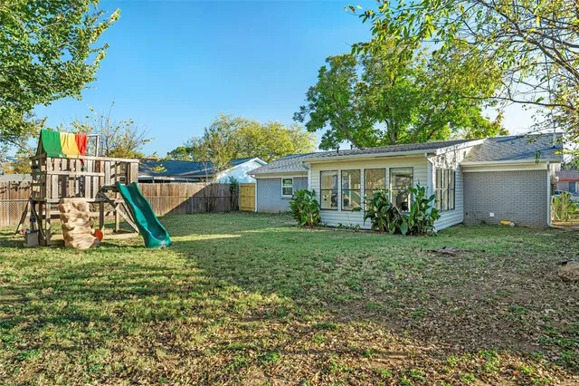 a view of a house with a park